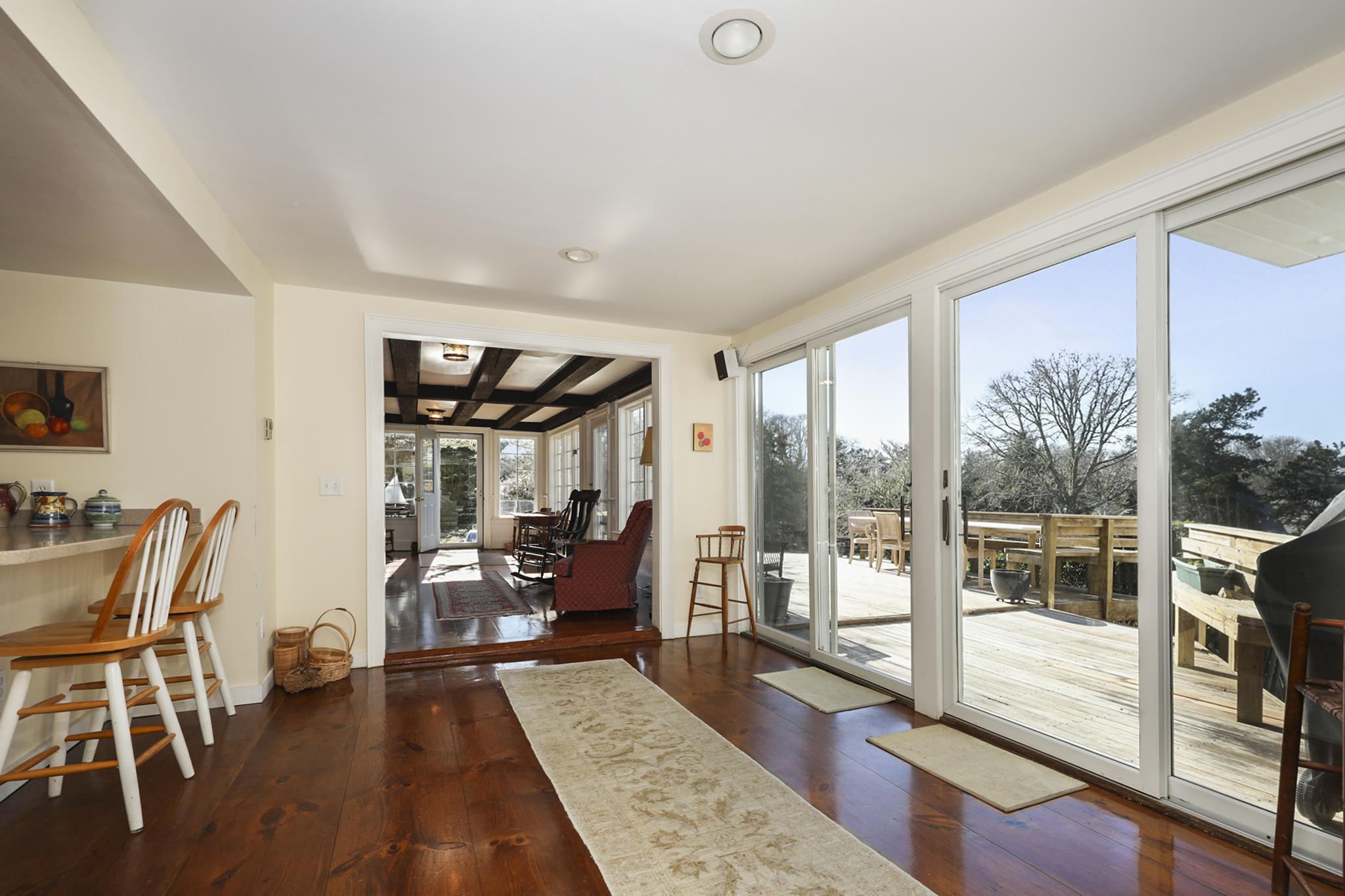 145 Barley Neck Road Orleans, MA 02653 - Photo 12 of 39 a living room with furniture tv and wooden floor