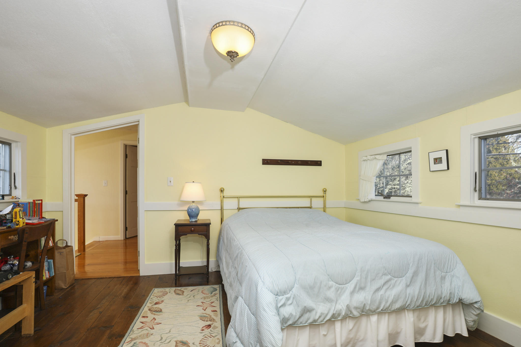 145 Barley Neck Road Orleans, MA 02653 - Photo 20 of 39 a bedroom with a bed and wooden floor