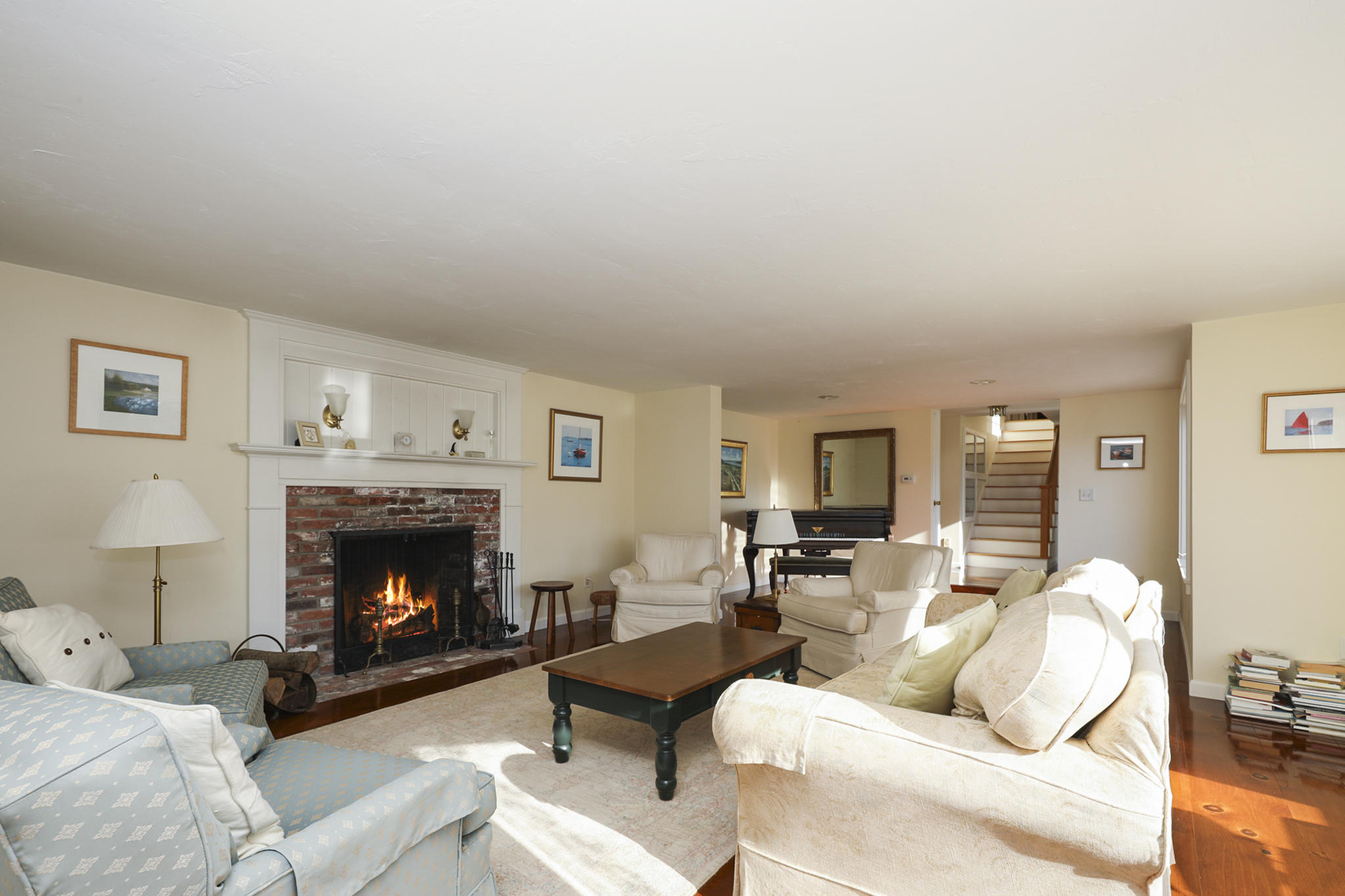 145 Barley Neck Road Orleans, MA 02653 - Photo 2 of 39 a living room with furniture a fireplace with wooden floor