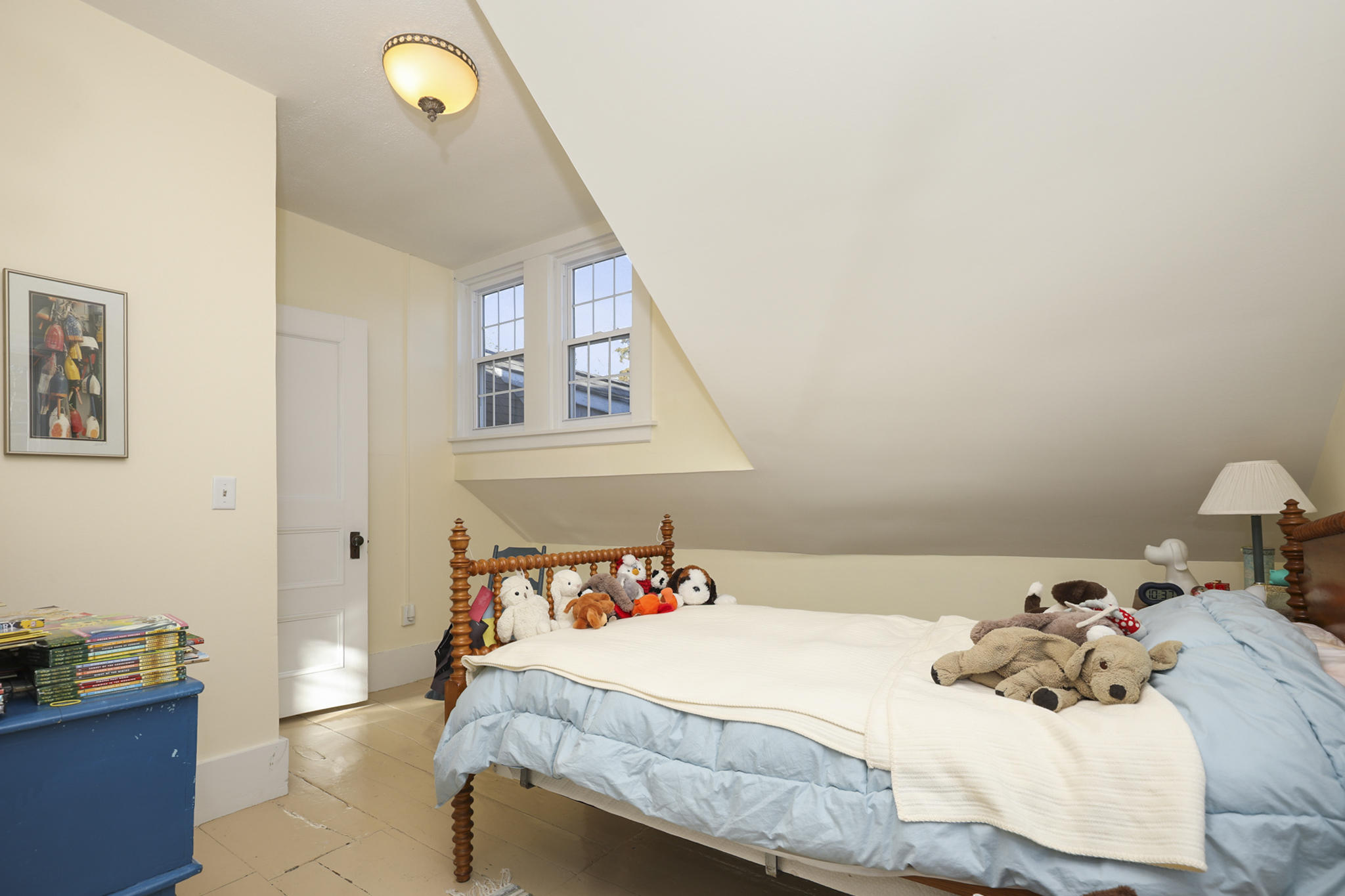 145 Barley Neck Road Orleans, MA 02653 - Photo 24 of 39 a bedroom with a bed and a cabinets