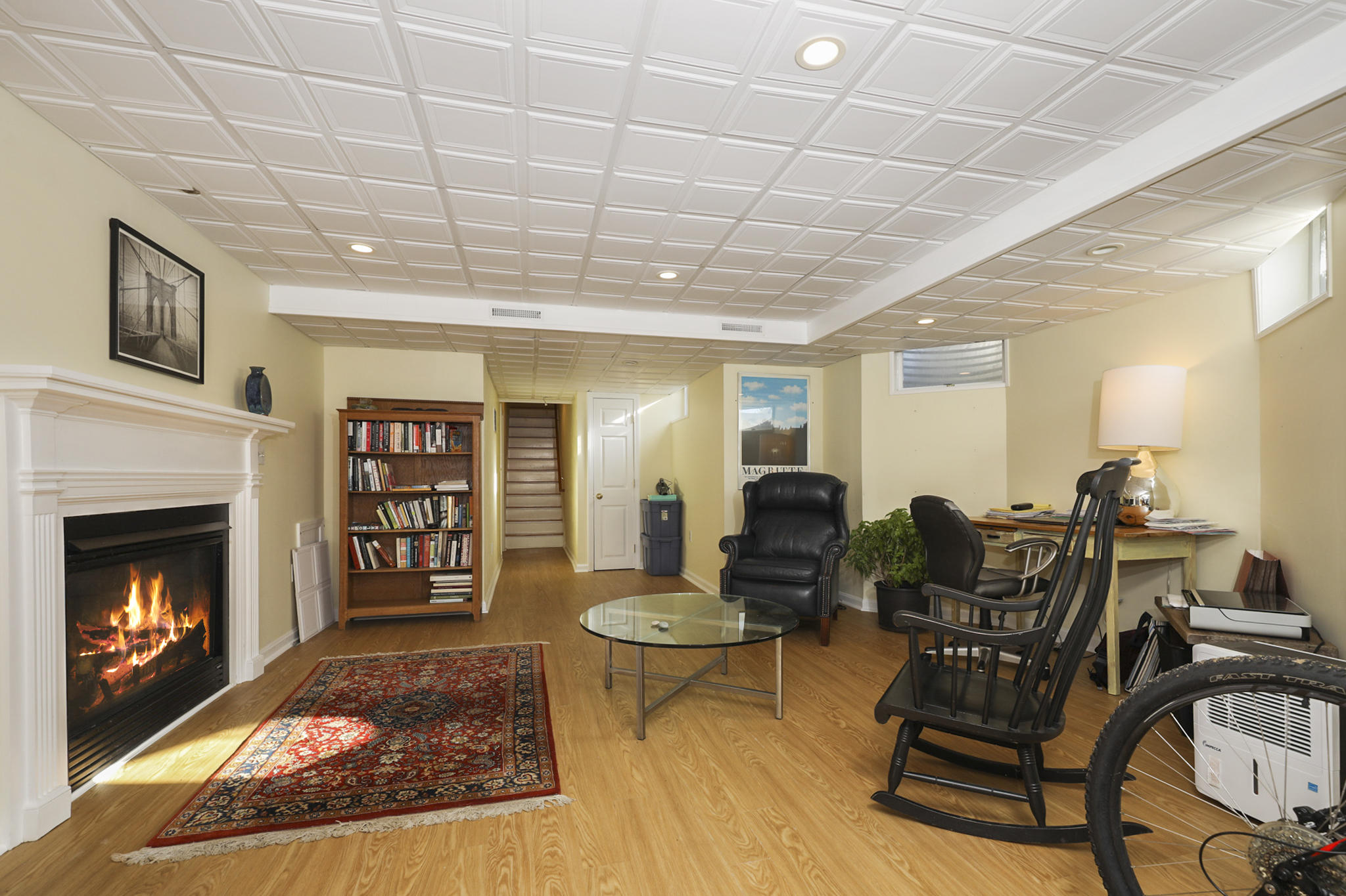145 Barley Neck Road Orleans, MA 02653 - Photo 27 of 39 a living room with furniture a piano and a fireplace