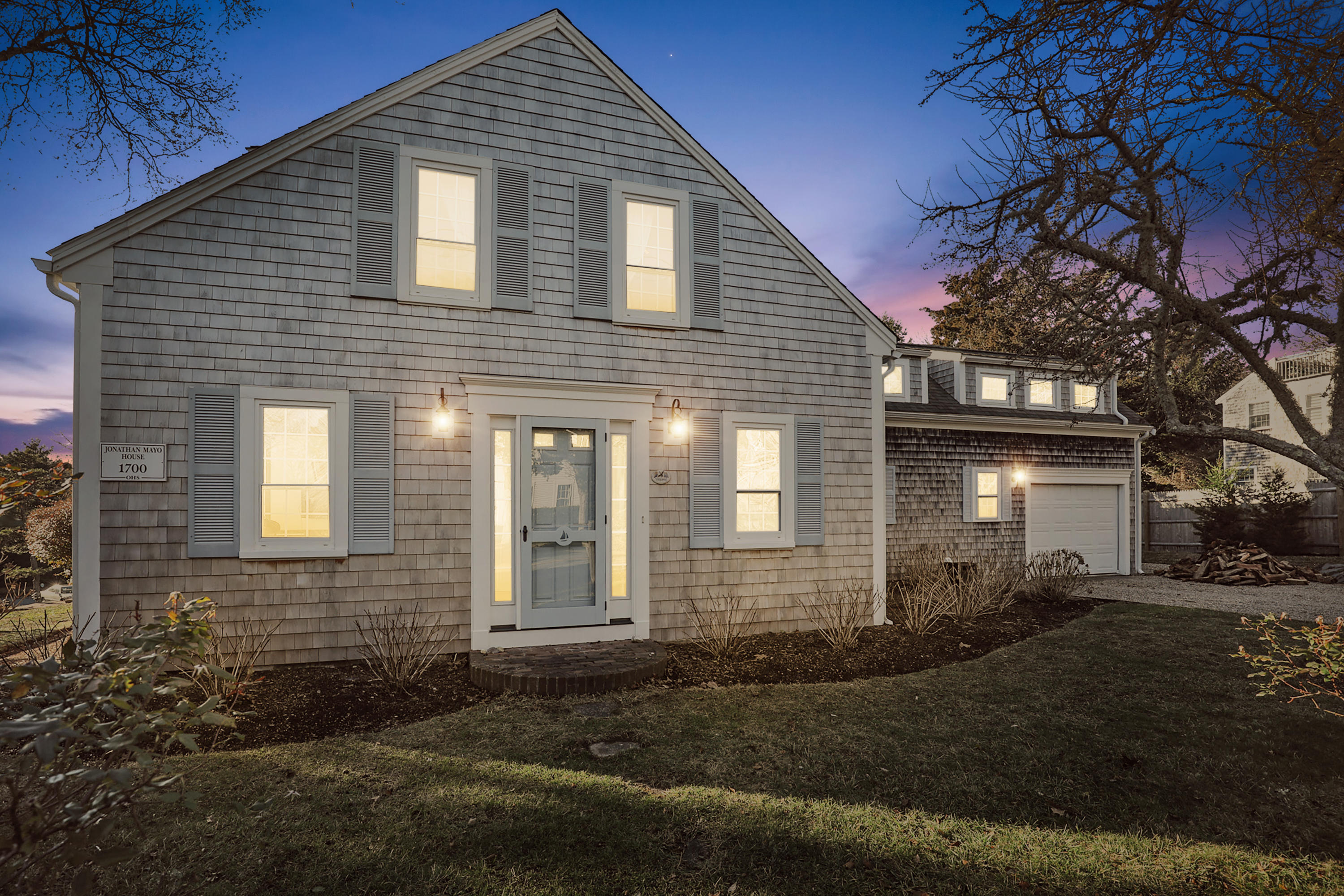 145 Barley Neck Road Orleans, MA 02653 - Photo 30 of 39 a front view of a house with a yard