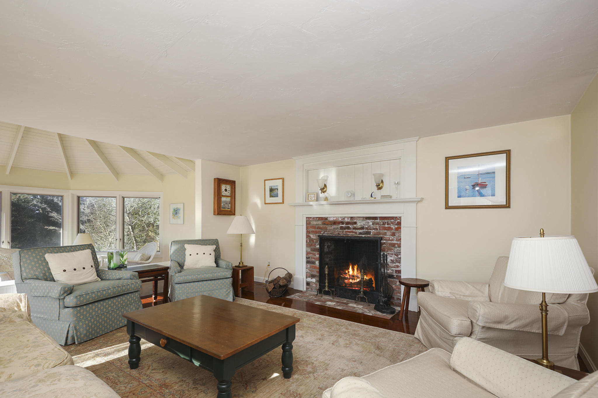 145 Barley Neck Road Orleans, MA 02653 - Photo 3 of 39 a living room with furniture and a fireplace