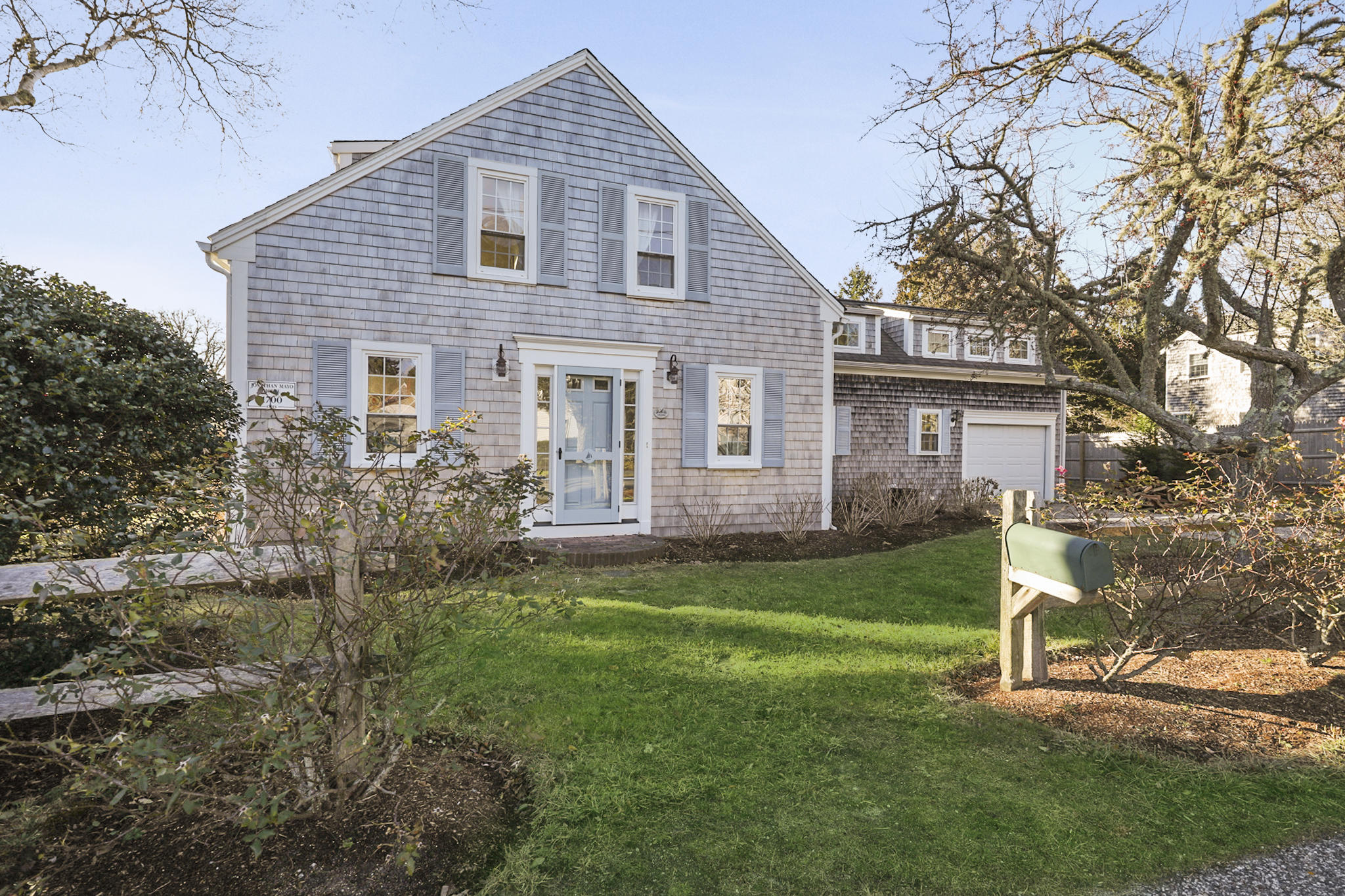 145 Barley Neck Road Orleans, MA 02653 - Photo 31 of 39 a view of a yard in front of a house with plants and large tree