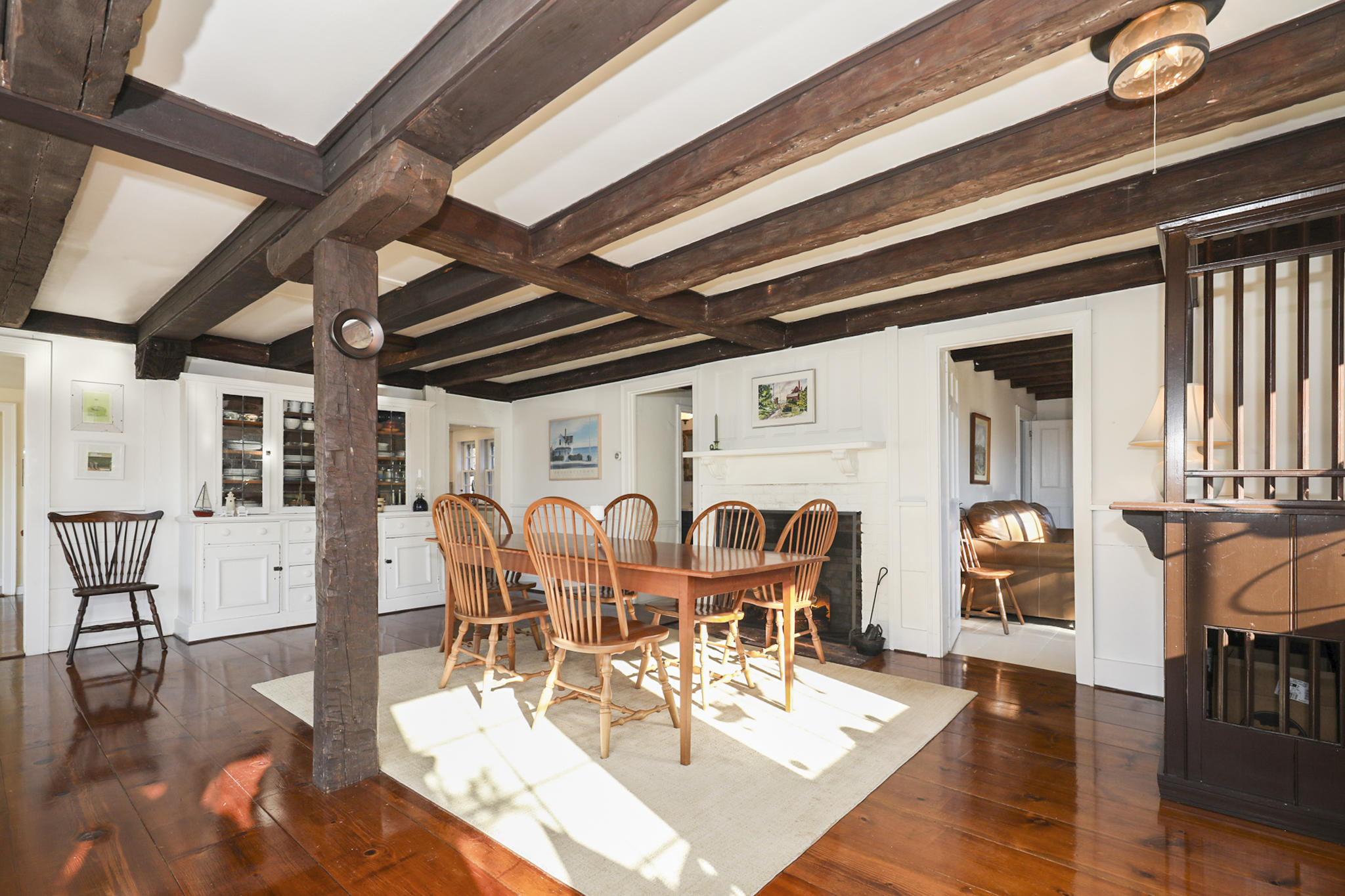 145 Barley Neck Road Orleans, MA 02653 - Photo 6 of 39 a view of a dining room with furniture wooden floor and a rug