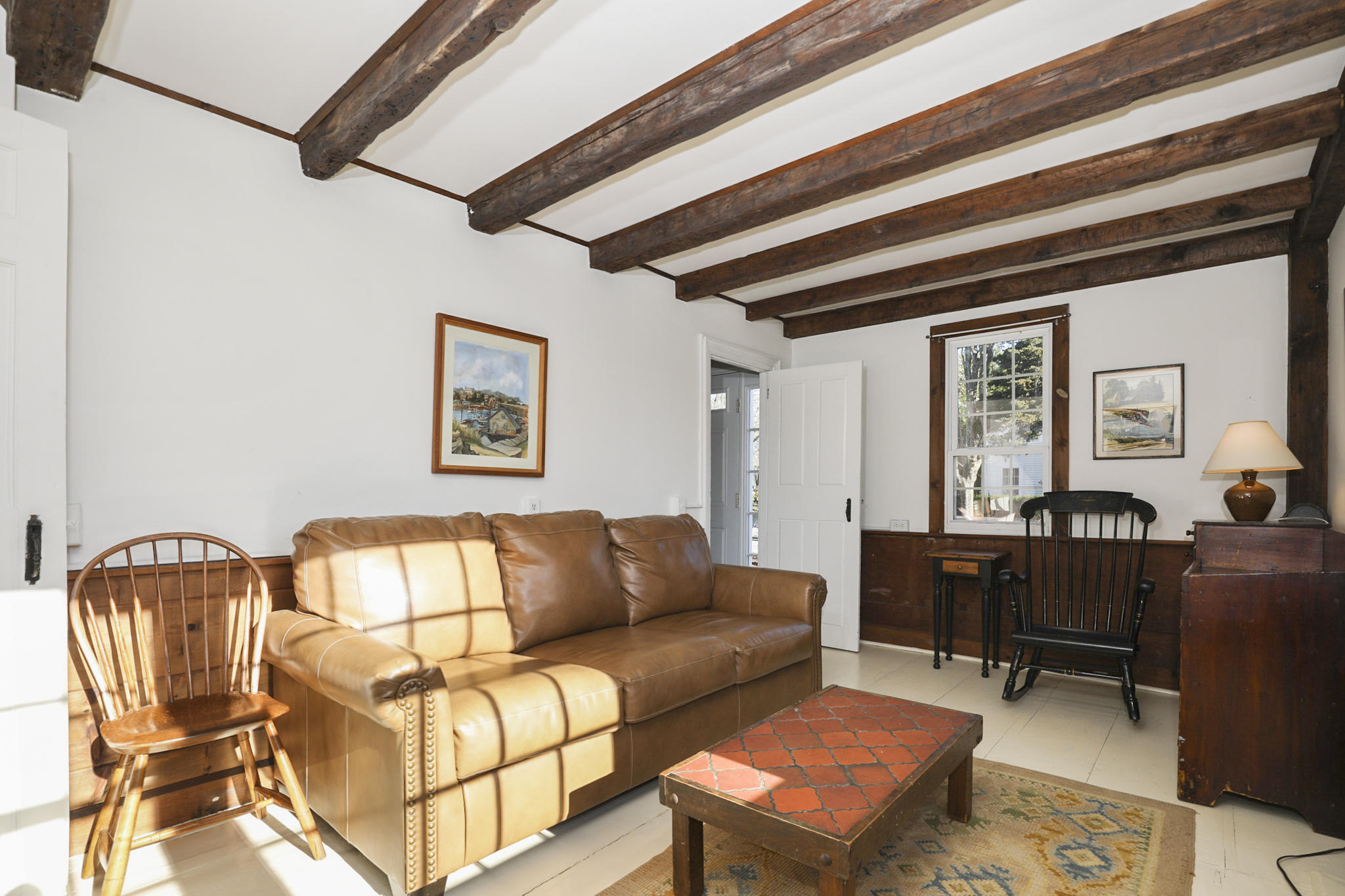 145 Barley Neck Road Orleans, MA 02653 - Photo 9 of 39 a living room with furniture a couch and dresser with wooden floor