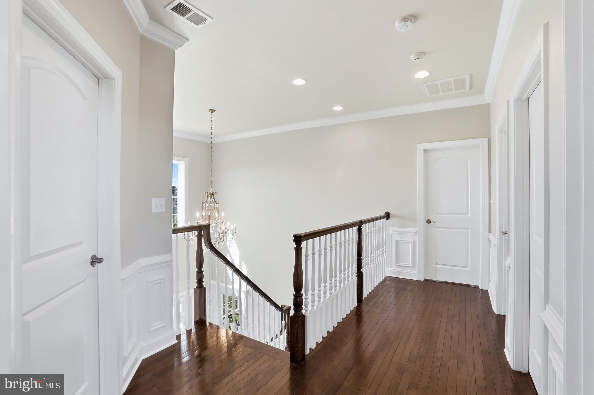 36972 Bridle Ridge Lane Purcellville, VA 20132 - Photo 24 of 44 a view of a hallway with wooden floor and staircase