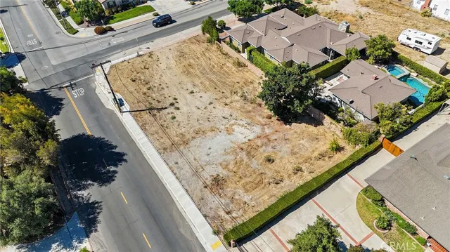 an aerial view of beach and front view of a house