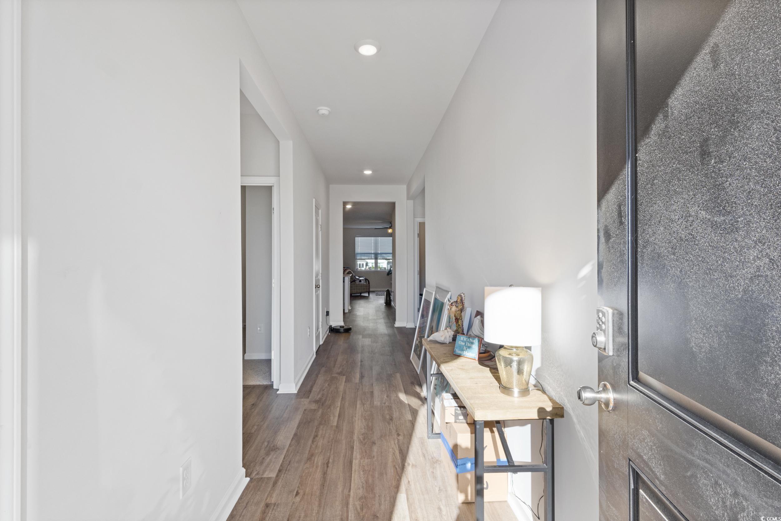 8034 Strudwick Drive Little River, SC 29566 - Photo 5 of 36 Hallway featuring light wood finished floors and recessed lighting