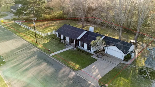 an aerial view of a house having swimming pool