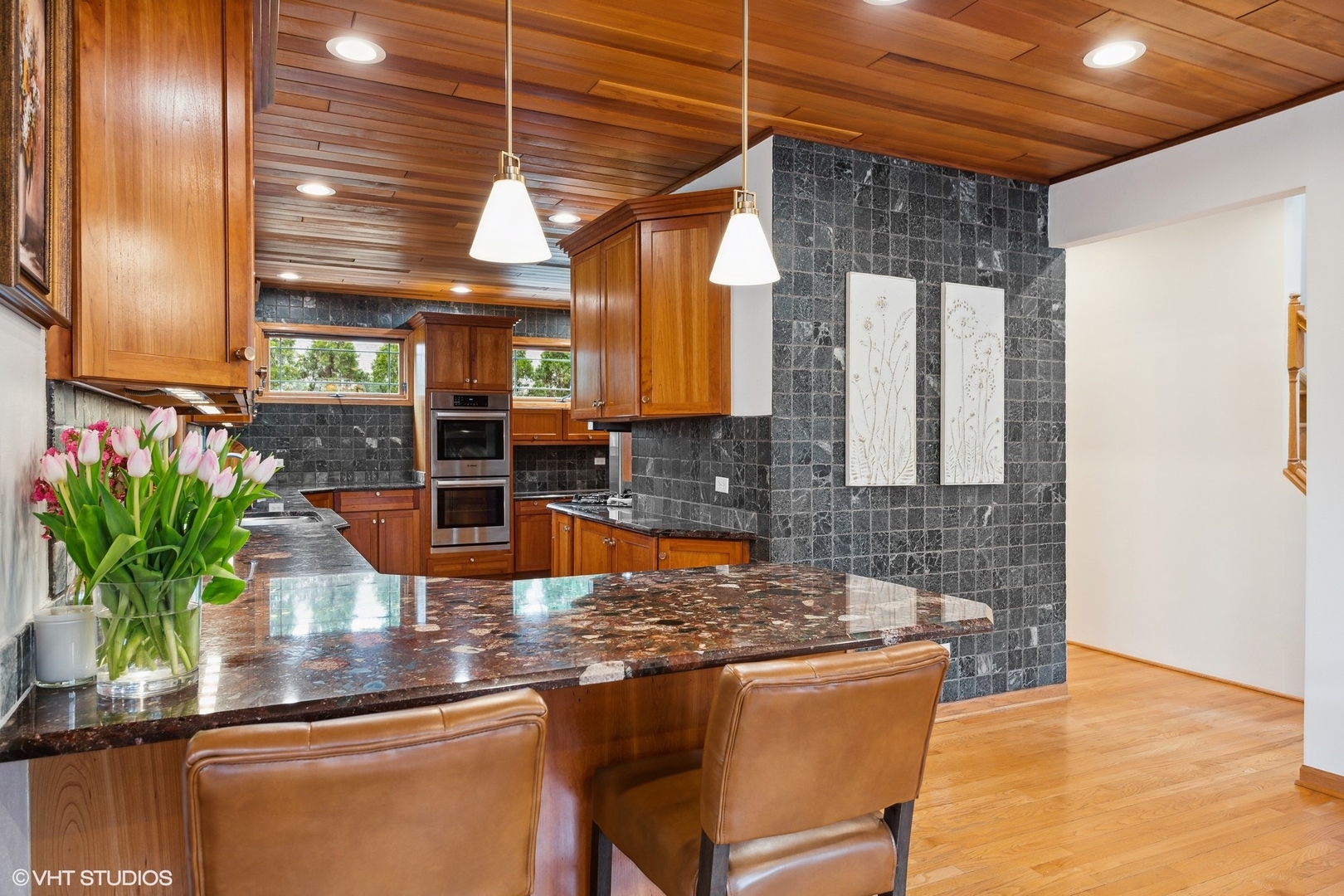 1939 Central Road Glenview, IL 60025 - Photo 12 of 34 a kitchen with stainless steel appliances granite countertop a sink a counter space cabinets and a potted plant