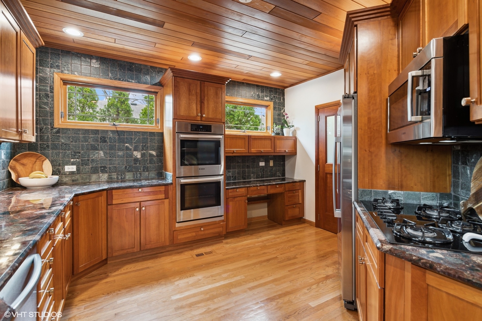 1939 Central Road Glenview, IL 60025 - Photo 8 of 34 a kitchen with stainless steel appliances granite countertop a stove a sink and a refrigerator