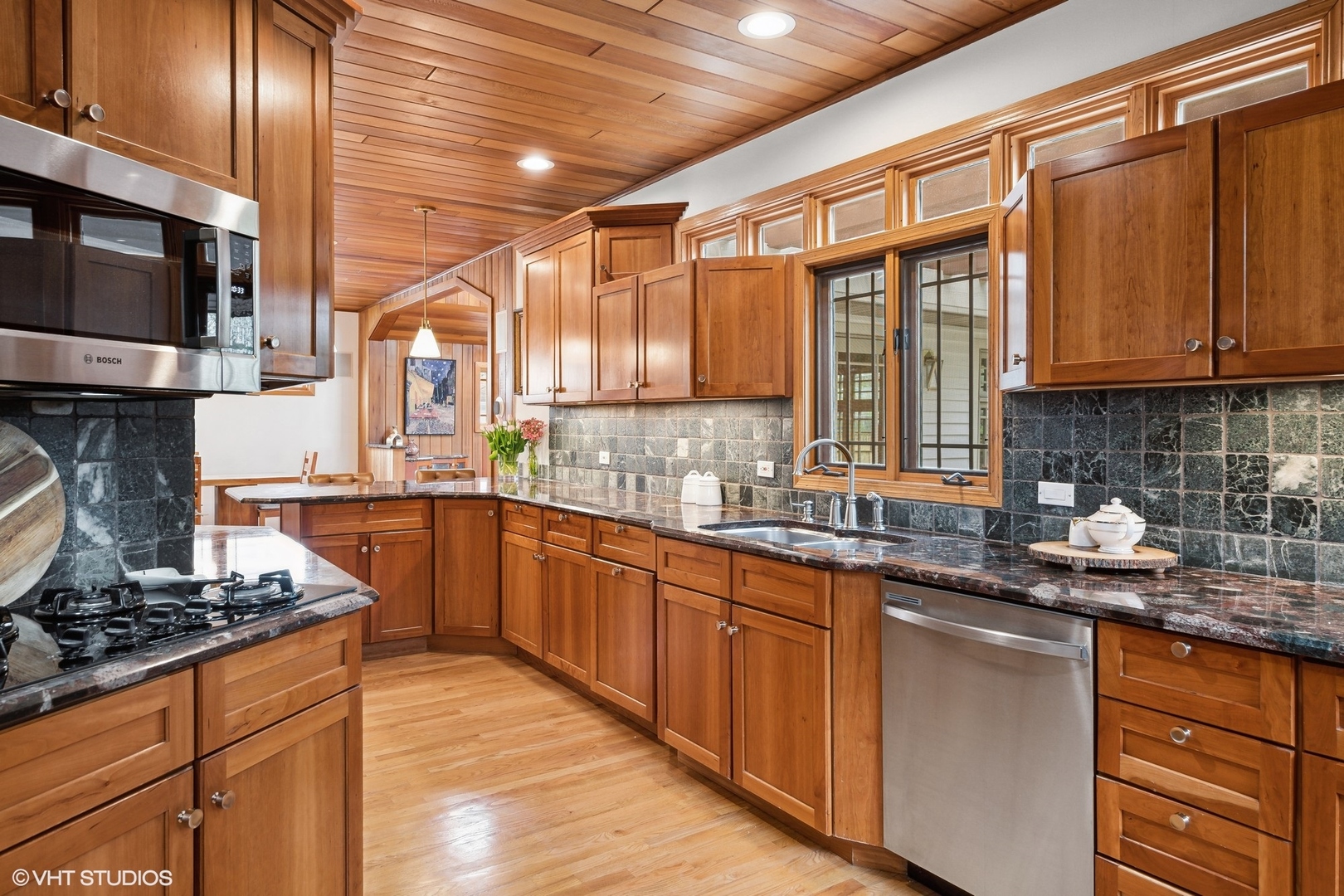 1939 Central Road Glenview, IL 60025 - Photo 9 of 34 a kitchen with stainless steel appliances granite countertop a sink stove and microwave
