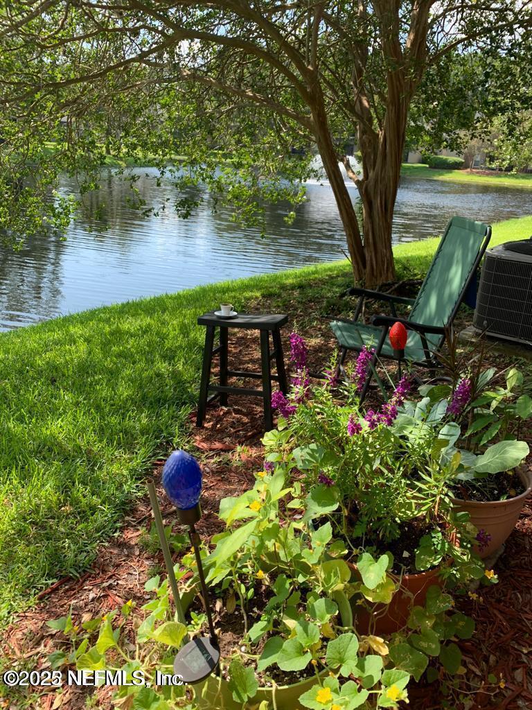 10200 Belle Rive Boulevard, Unit 83 Jacksonville, FL 32256 - Photo 1 of 21 a backyard of a house with lots of green space and trees