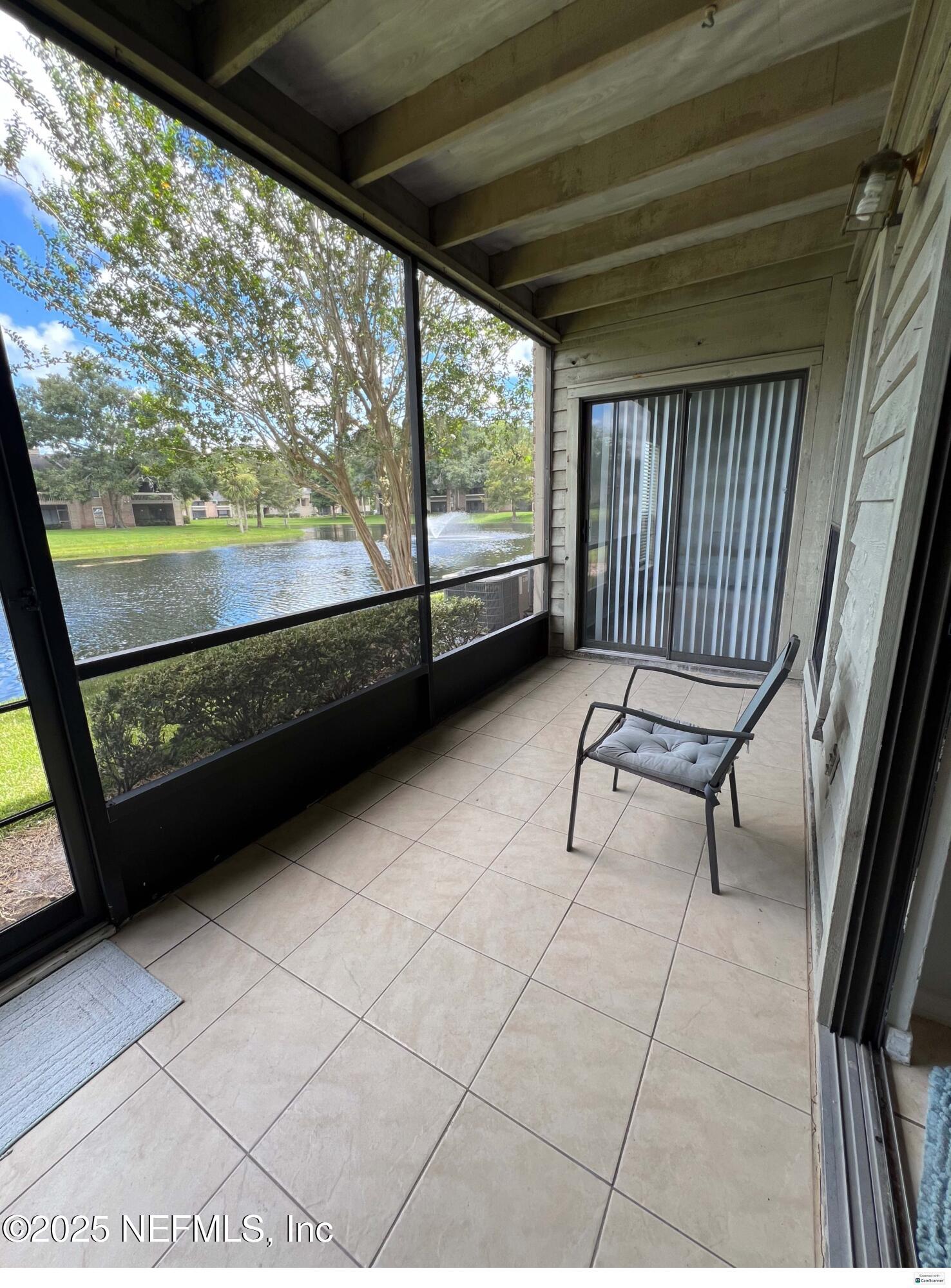 10200 Belle Rive Boulevard, Unit 83 Jacksonville, FL 32256 - Photo 12 of 21 a view of two chairs in the balcony