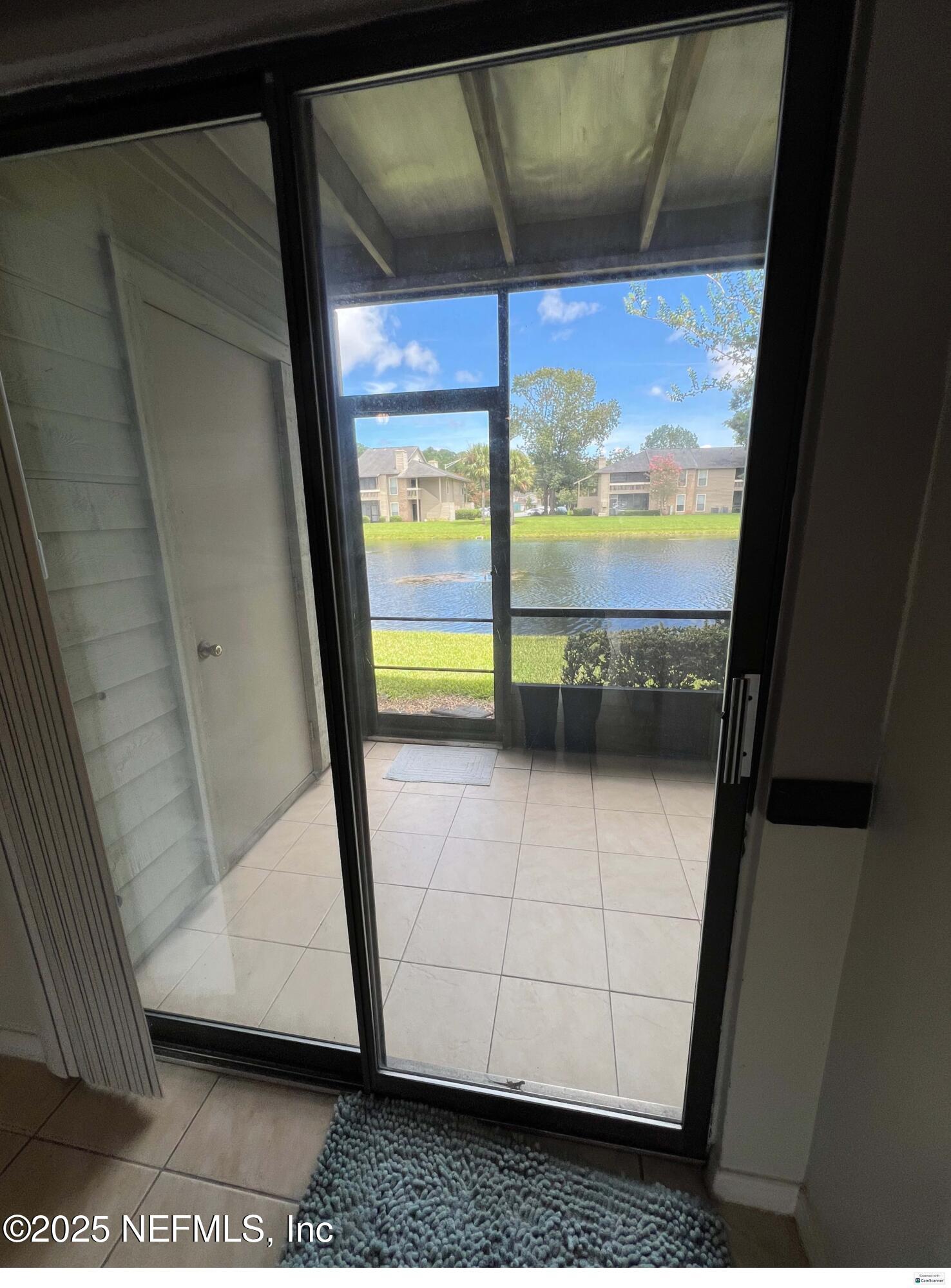 10200 Belle Rive Boulevard, Unit 83 Jacksonville, FL 32256 - Photo 17 of 21 a view of a glass door of the house