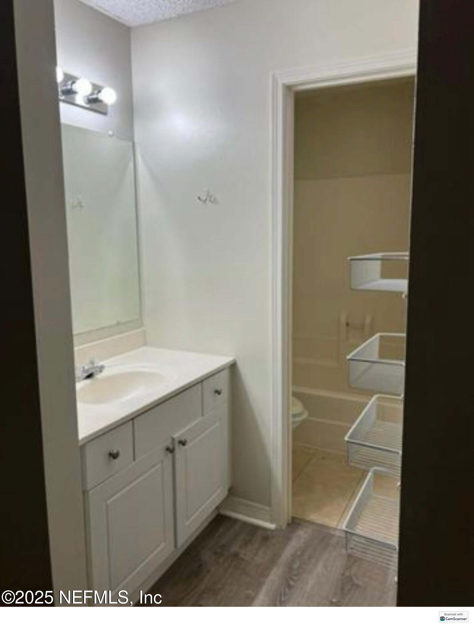 10200 Belle Rive Boulevard, Unit 83 Jacksonville, FL 32256 - Photo 2 of 21 a bathroom with a shower and a sink