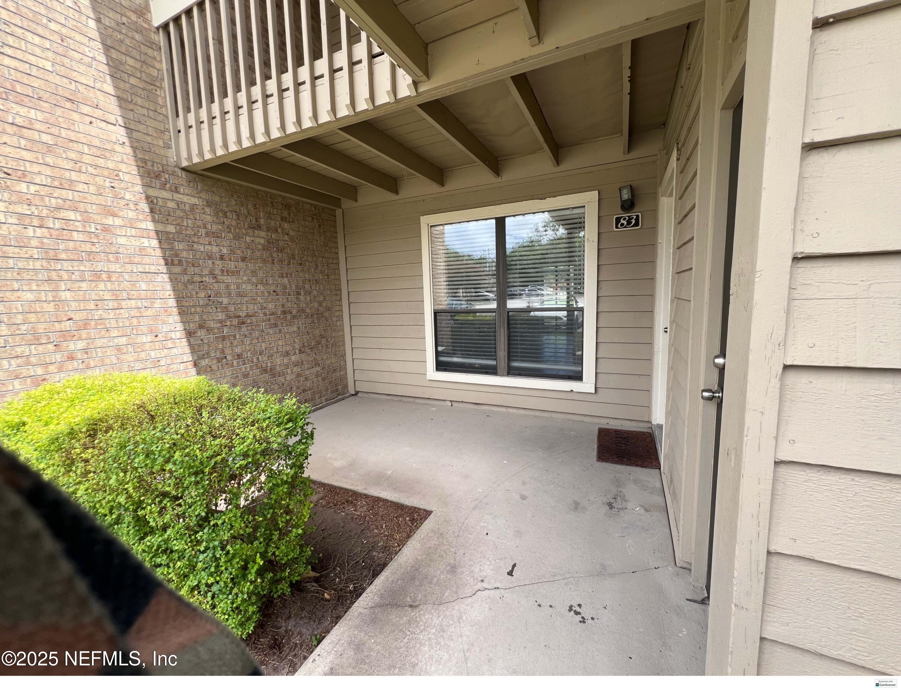 10200 Belle Rive Boulevard, Unit 83 Jacksonville, FL 32256 - Photo 21 of 21 a view of a porch with a bench