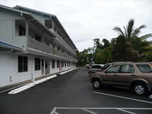a view of a car park in front of house