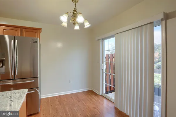 a view of a bathroom with washing machine and sink