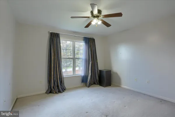 an empty room with a bathroom