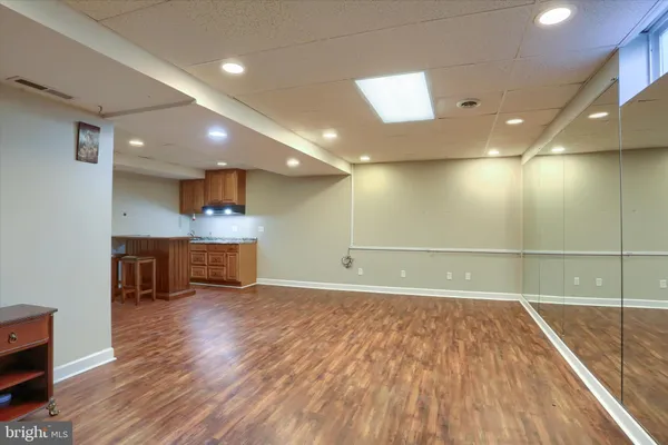 a view of a livingroom with furniture and wooden floor