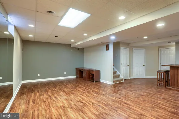 a view of kitchen with furniture and wooden floor