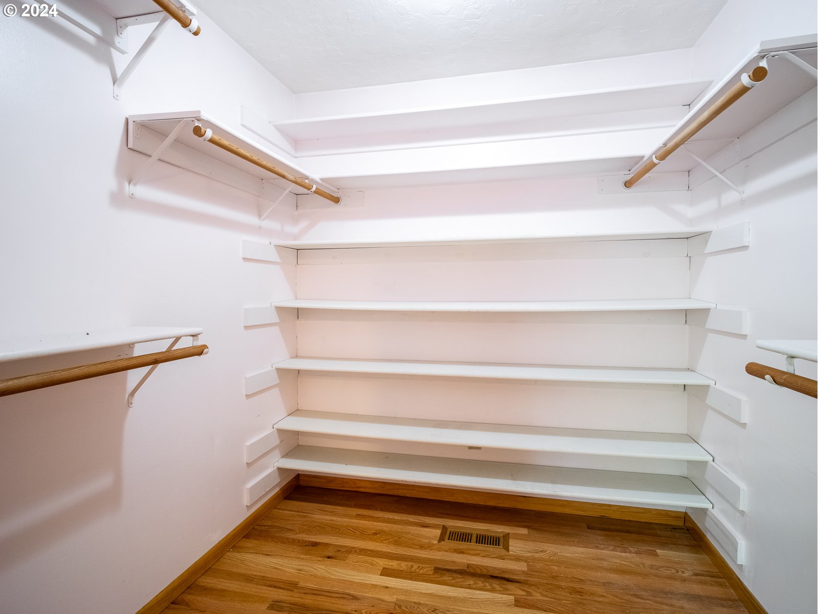 3238 Southeast 176th Place Portland, OR 97236 - Photo 19 of 31 a view of walk in closet with empty racks