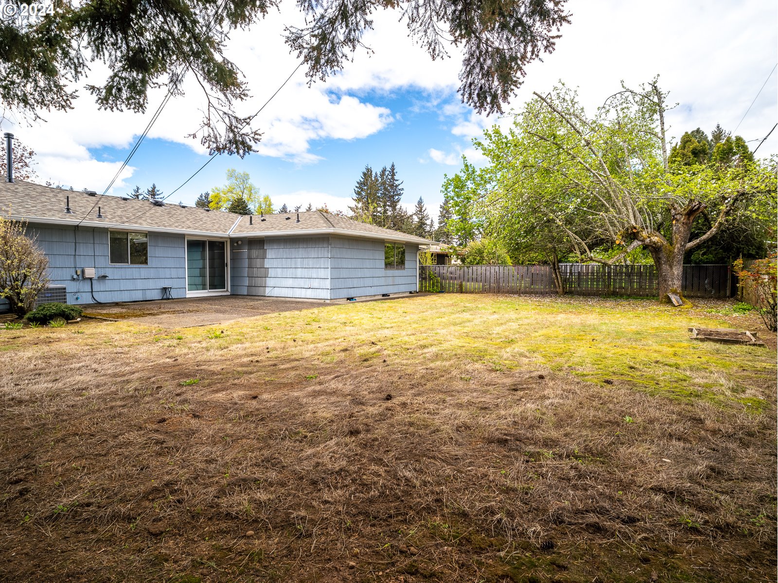 3238 Southeast 176th Place Portland, OR 97236 - Photo 25 of 31 a view of a house with swimming pool and a yard