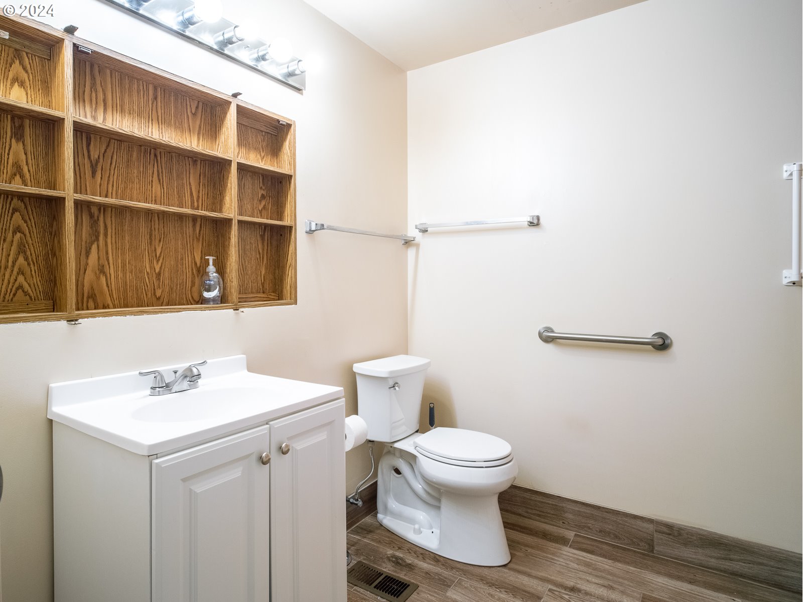 3238 Southeast 176th Place Portland, OR 97236 - Photo 26 of 31 a bathroom with a sink a toilet and a mirror