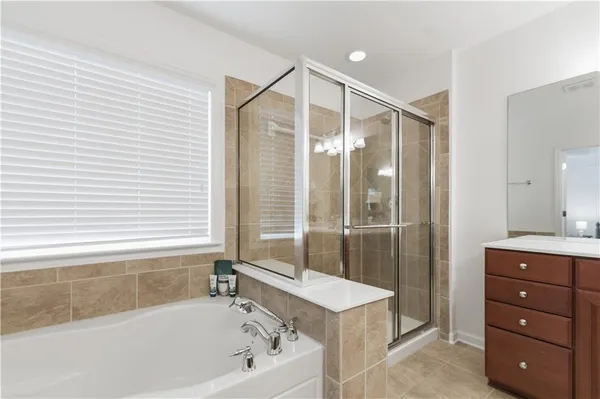 a large white bed in a white room