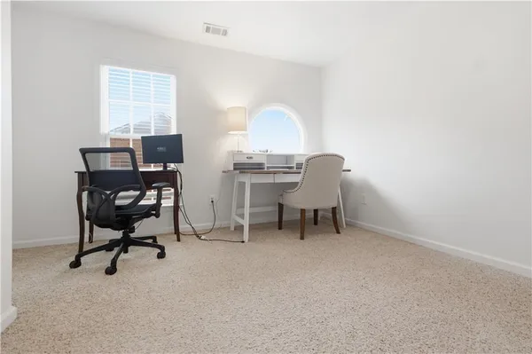 a workspace with furniture and a window