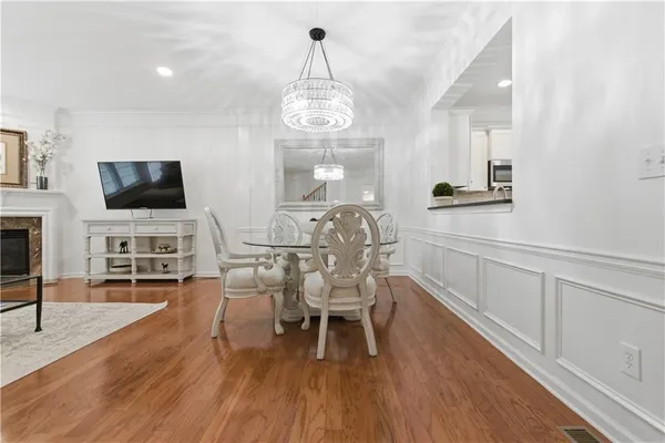 a balcony with wooden floor and fence