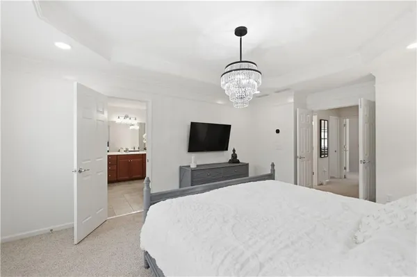 a bathroom with a sink vanity granite tub and shower