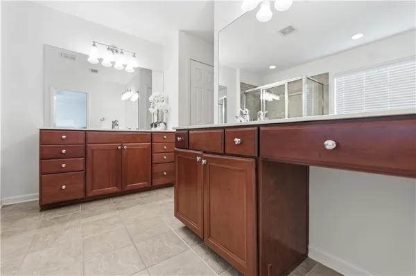 a white bath tub sitting in a bathroom next to a window