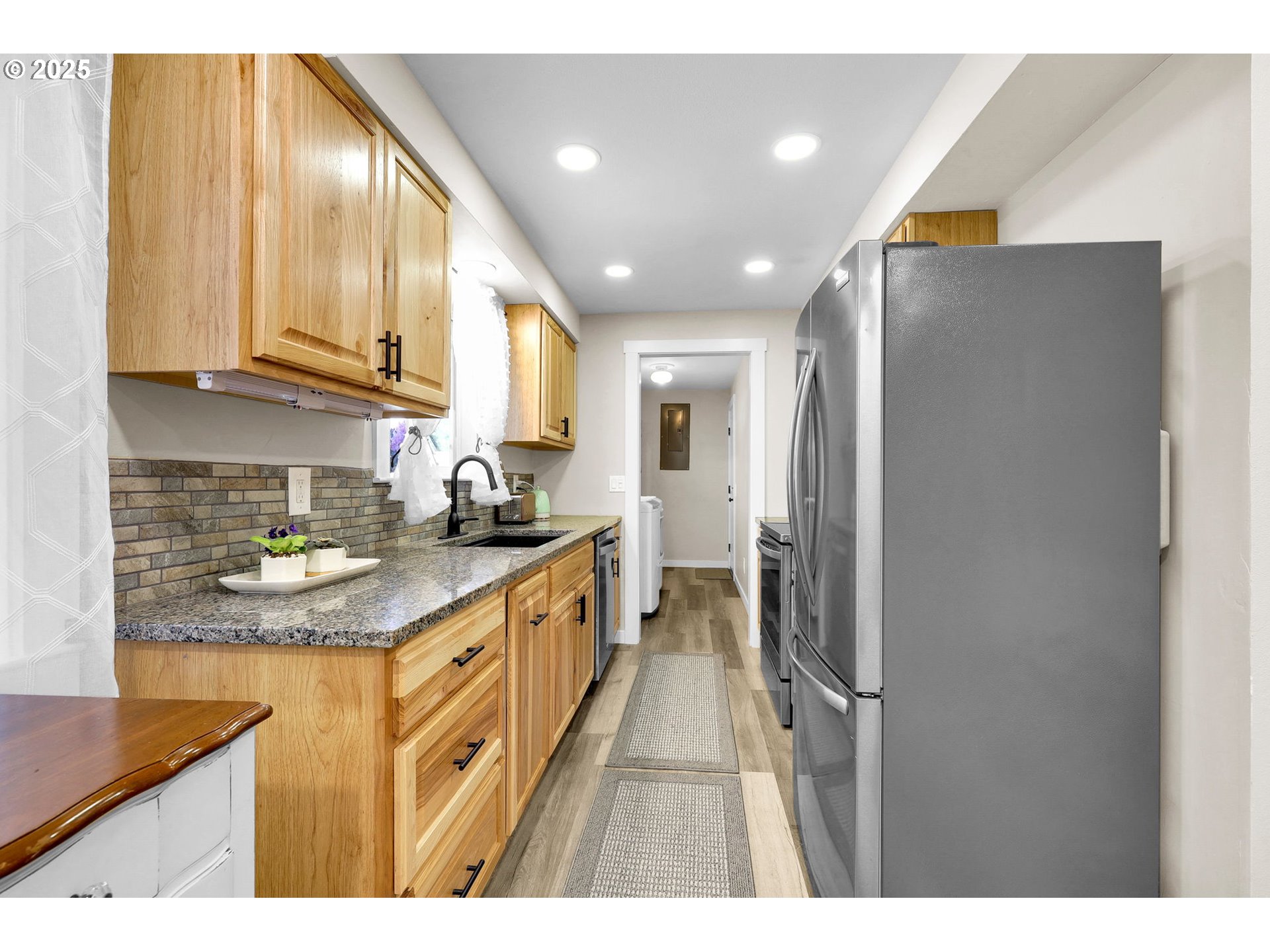 3045 Pheasant Boulevard Springfield, OR 97477 - Photo 13 of 43 a kitchen with stainless steel appliances granite countertop a refrigerator and a sink
