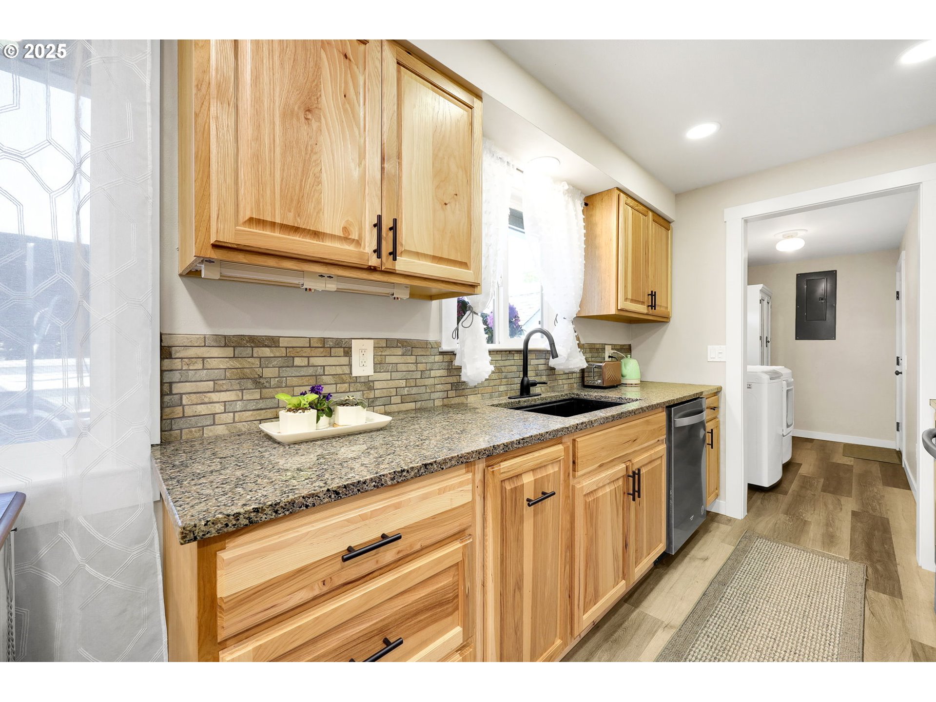 3045 Pheasant Boulevard Springfield, OR 97477 - Photo 17 of 43 a kitchen with stainless steel appliances granite countertop a sink and cabinets