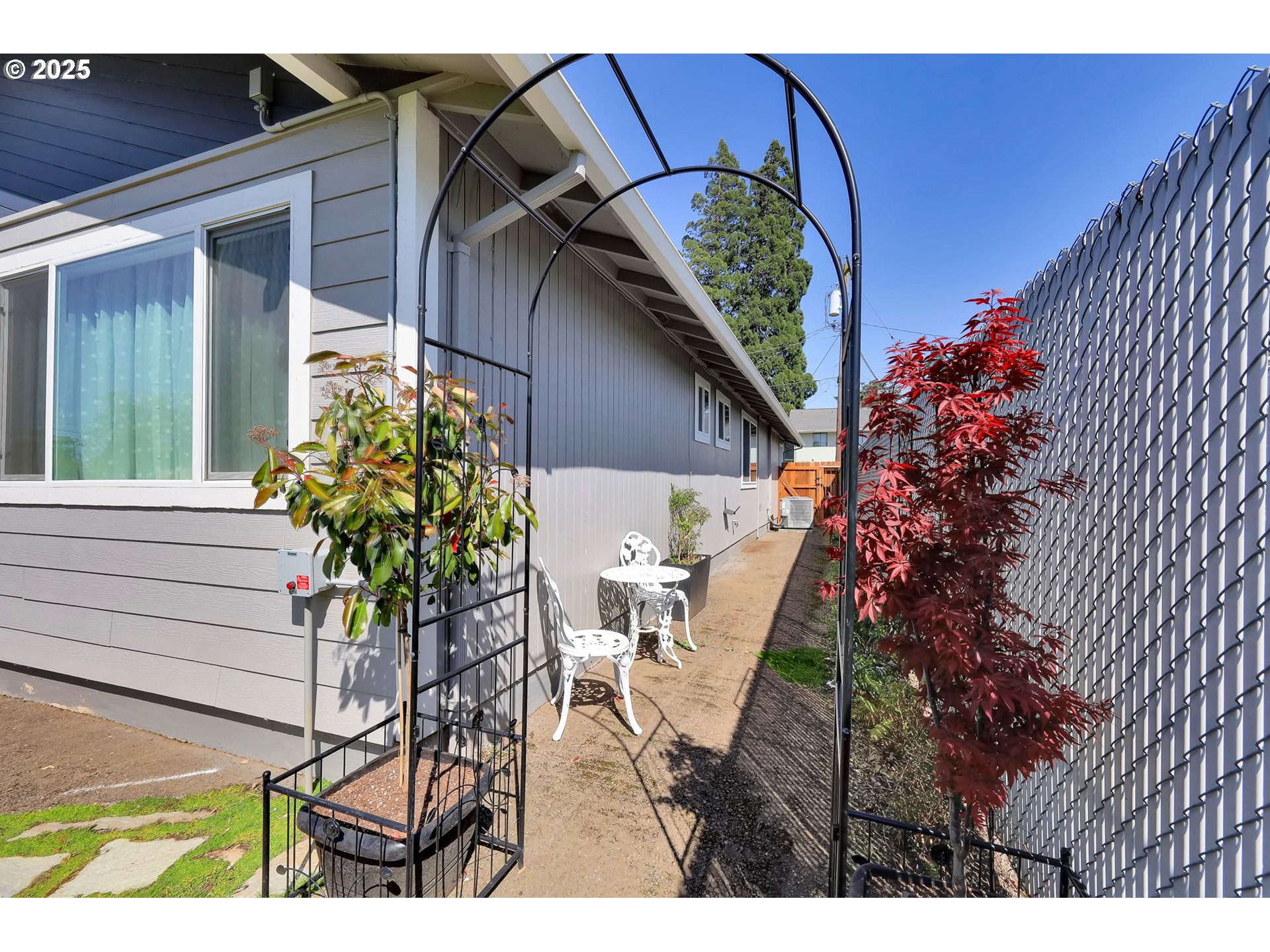 3045 Pheasant Boulevard Springfield, OR 97477 - Photo 37 of 43 a potted plant sitting in front of a house