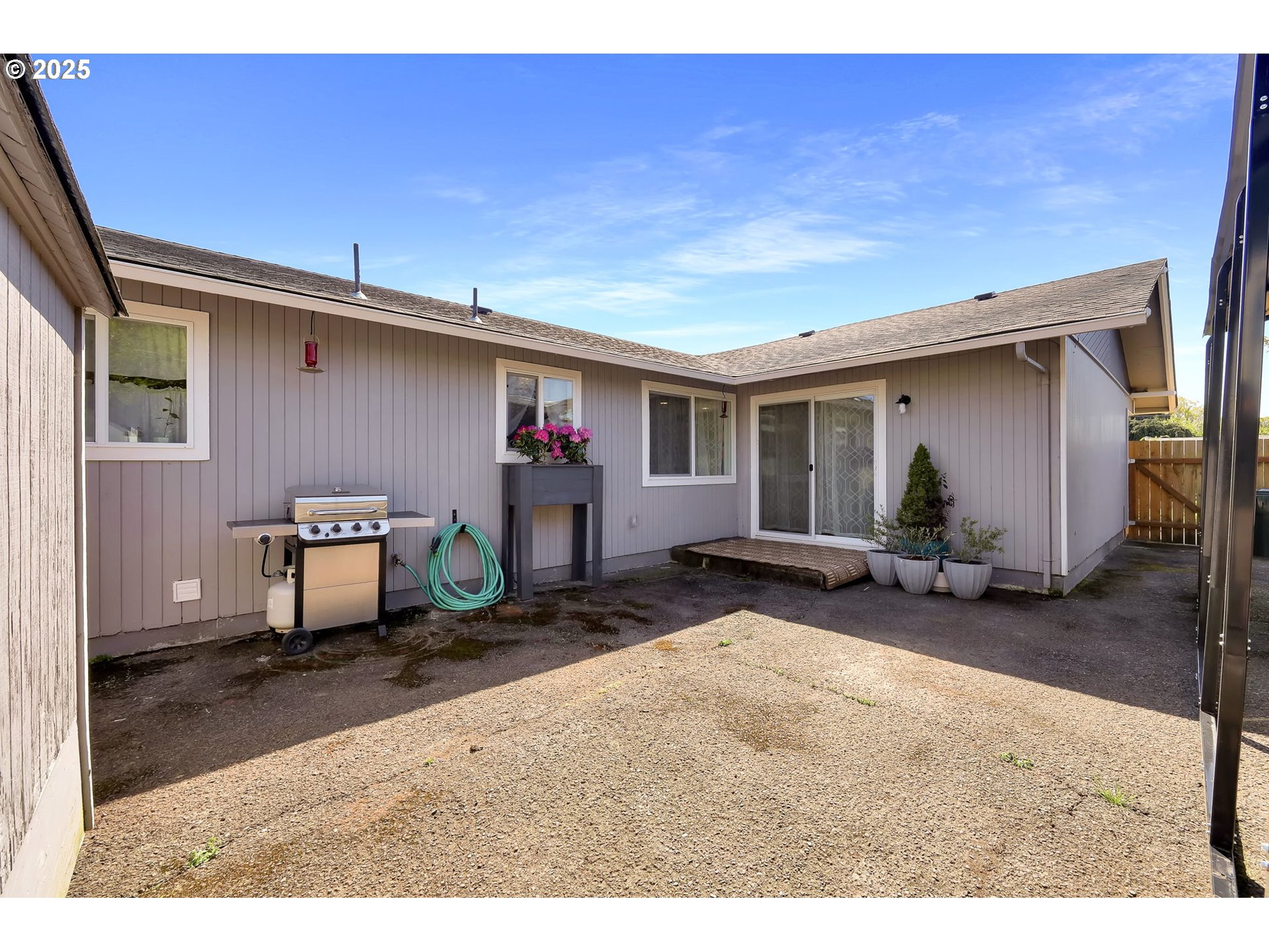 3045 Pheasant Boulevard Springfield, OR 97477 - Photo 39 of 43 a backyard of a house with barbeque oven table and chairs