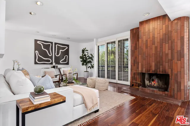a bedroom with furniture and a fireplace