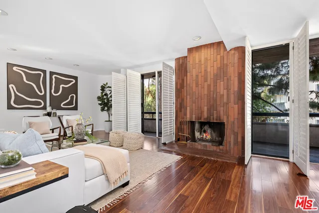 a bedroom with a bed and a fireplace