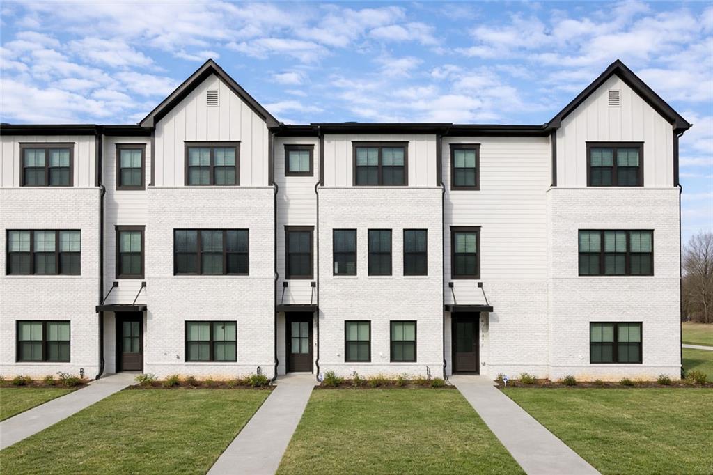 a view of house with yard