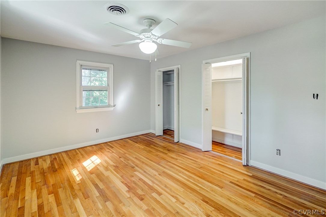 11411 Rochelle Road Chester, VA 23831 - Photo 23 of 50 a view of an empty room with wooden floor and a window