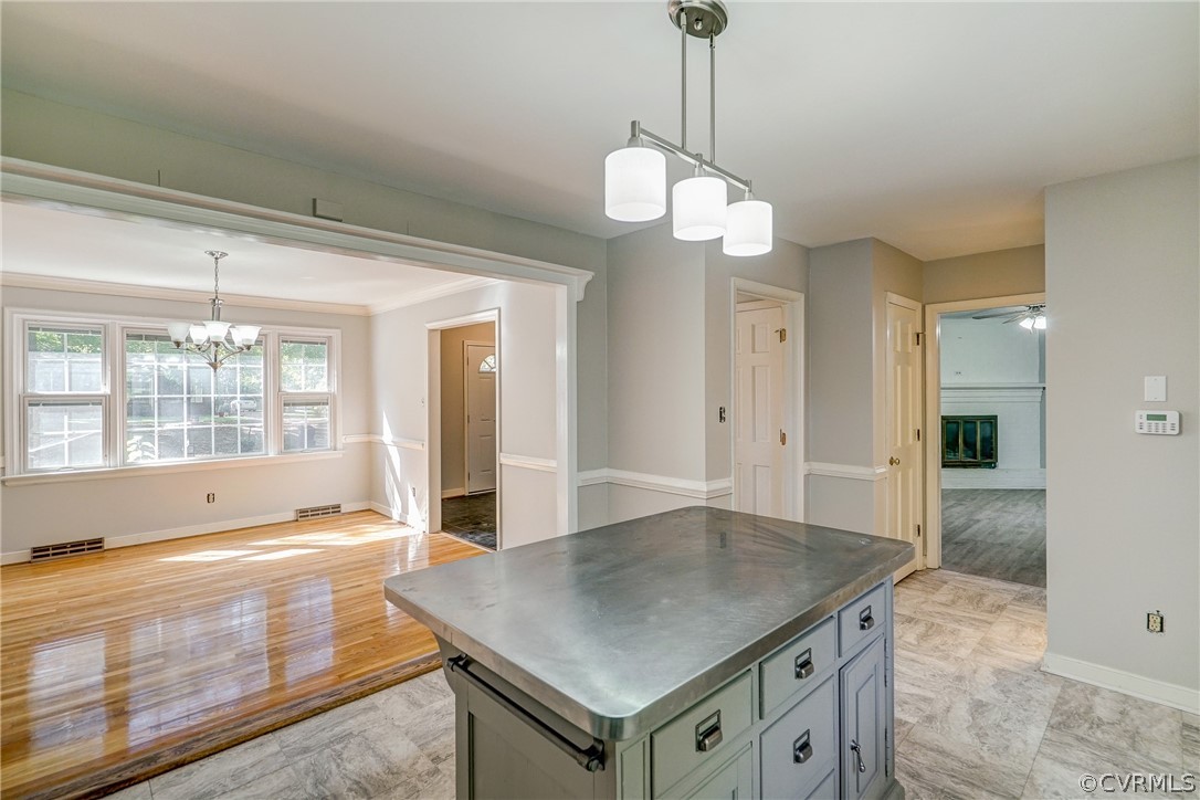 11411 Rochelle Road Chester, VA 23831 - Photo 25 of 50 a view of a kitchen with a sink cabinets and wooden floor