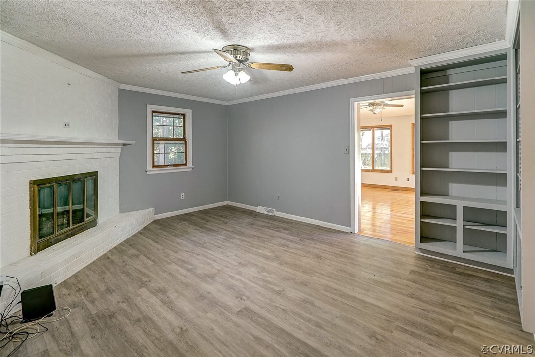 11411 Rochelle Road Chester, VA 23831 - Photo 26 of 50 a view of an empty room with a window and fireplace