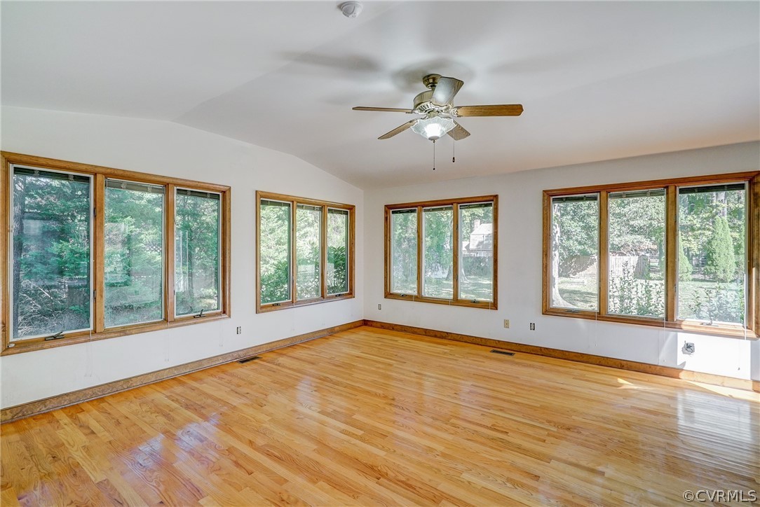 11411 Rochelle Road Chester, VA 23831 - Photo 28 of 50 a view of an empty room with a window and wooden floor