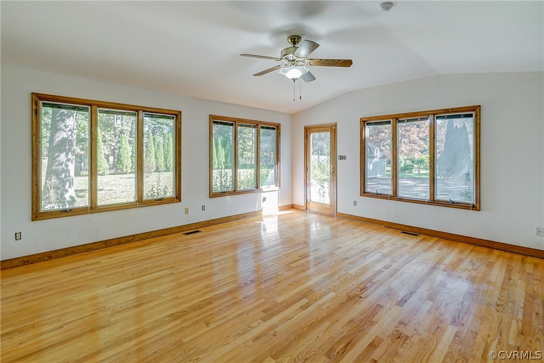 11411 Rochelle Road Chester, VA 23831 - Photo 29 of 50 a view of an empty room with a window and wooden floor