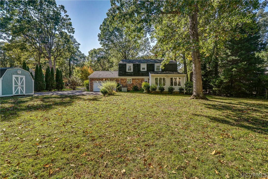 11411 Rochelle Road Chester, VA 23831 - Photo 45 of 50 a front view of a house with a yard