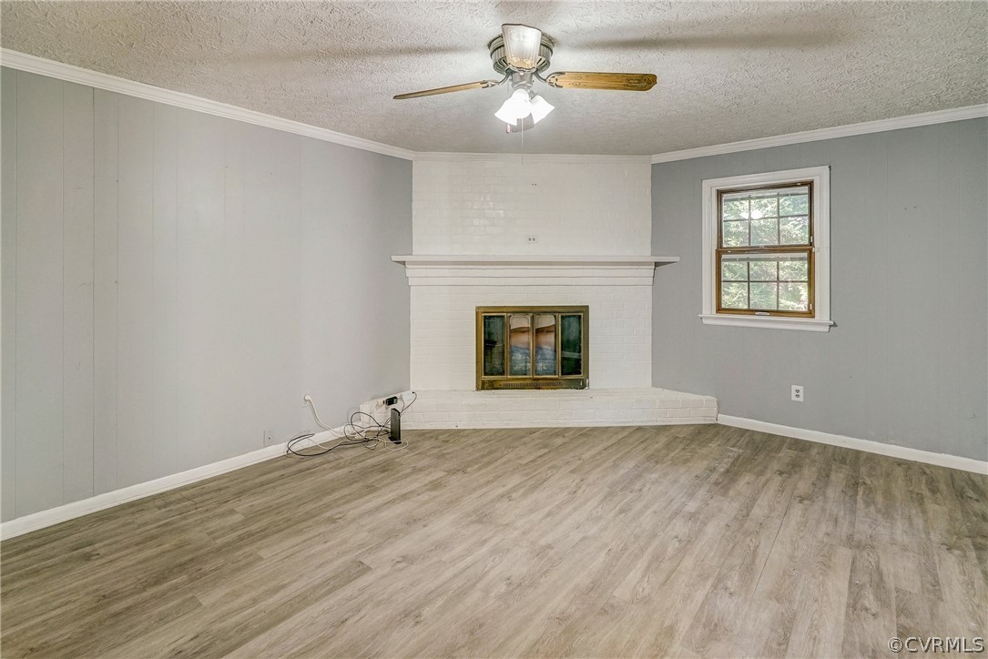 11411 Rochelle Road Chester, VA 23831 - Photo 10 of 50 an empty room with windows and fan