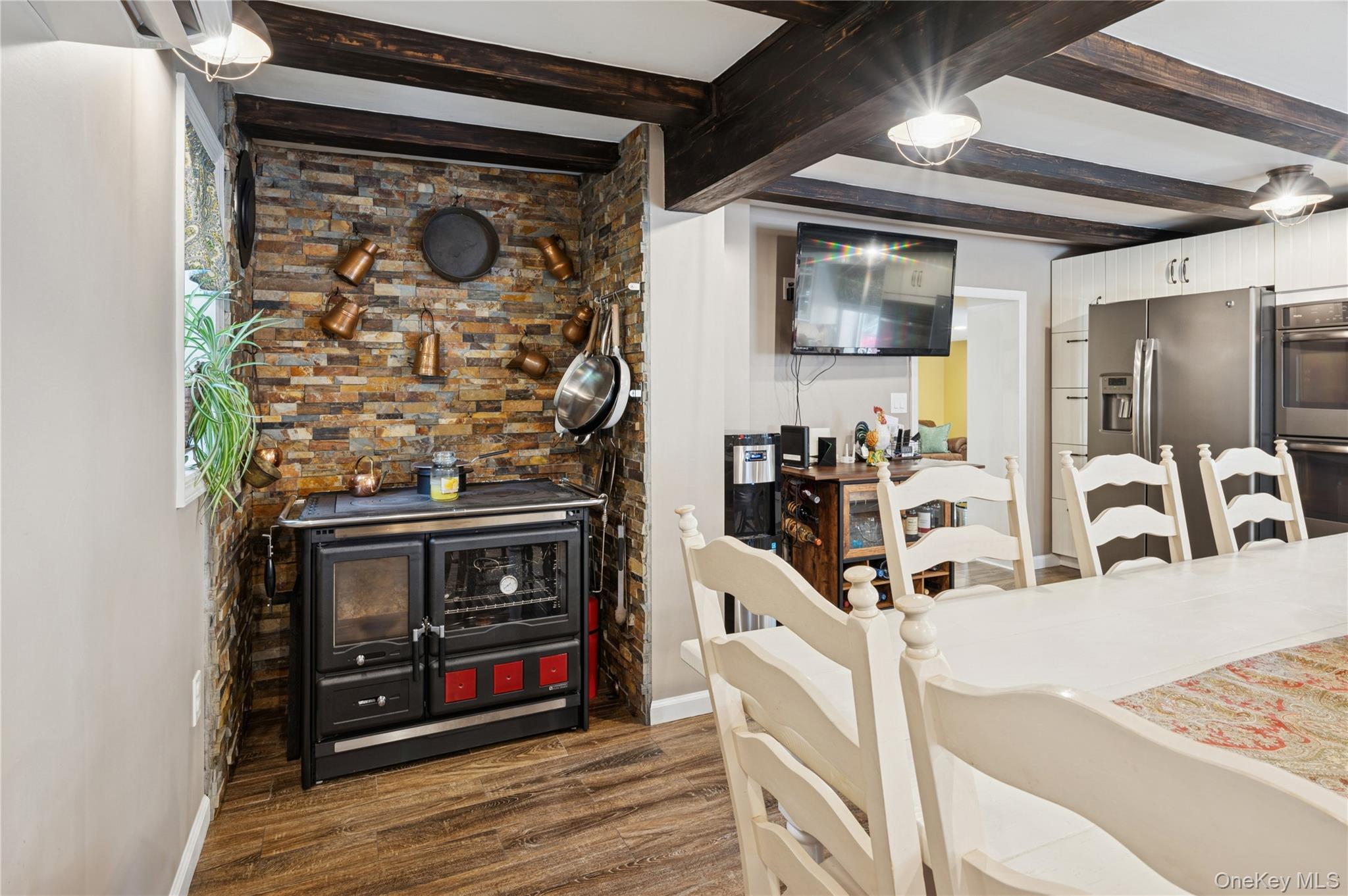 123 Pleasant Road Lake Peekskill, NY 10537 - Photo 12 of 50 a kitchen with stainless steel appliances granite countertop a stove and a wooden floor